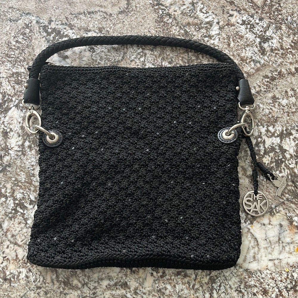 Saks The Sak in black knit material, silver hardware.